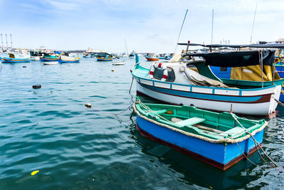 Boats moored at harbor