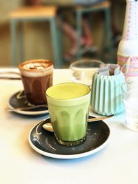 Close-up of drinks served on table