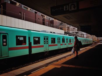 People on railroad station platform