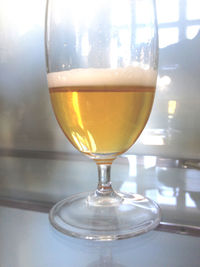 Close-up of wine glass on wooden table