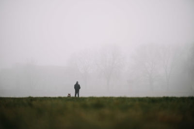 Man on field against sky