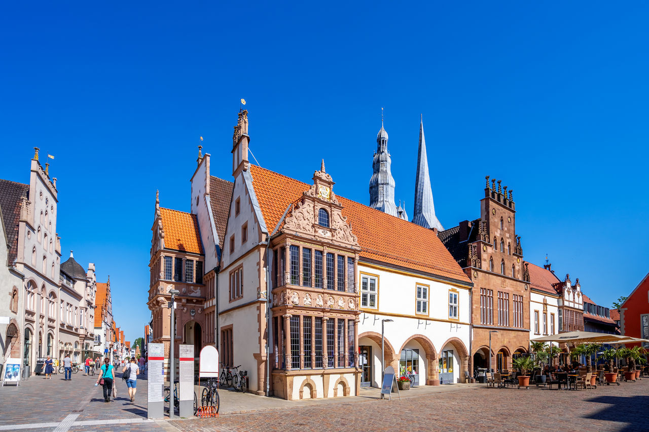 BUILDINGS AGAINST BLUE SKY