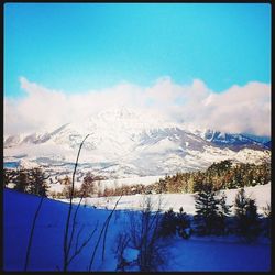 Scenic view of snow covered mountains