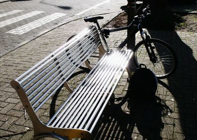 High angle view of shadow on bicycle