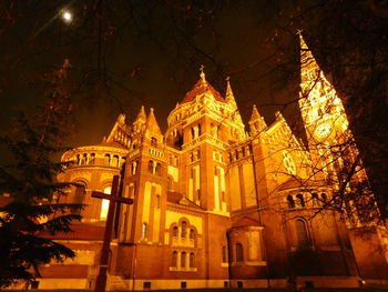 Low angle view of illuminated building at night