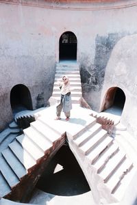 High angle view of women standing on staircase