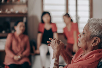 Close-up of senior woman resting at home