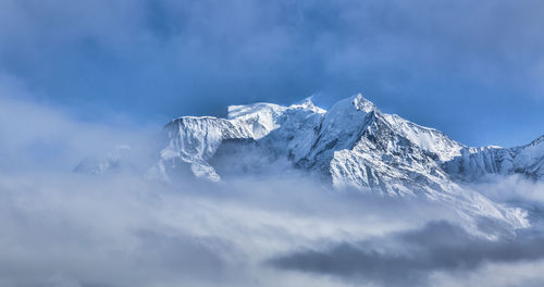 Scenic view of snowcapped mountains against sky