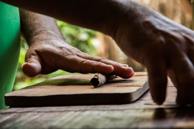 Close-up of man working on wood