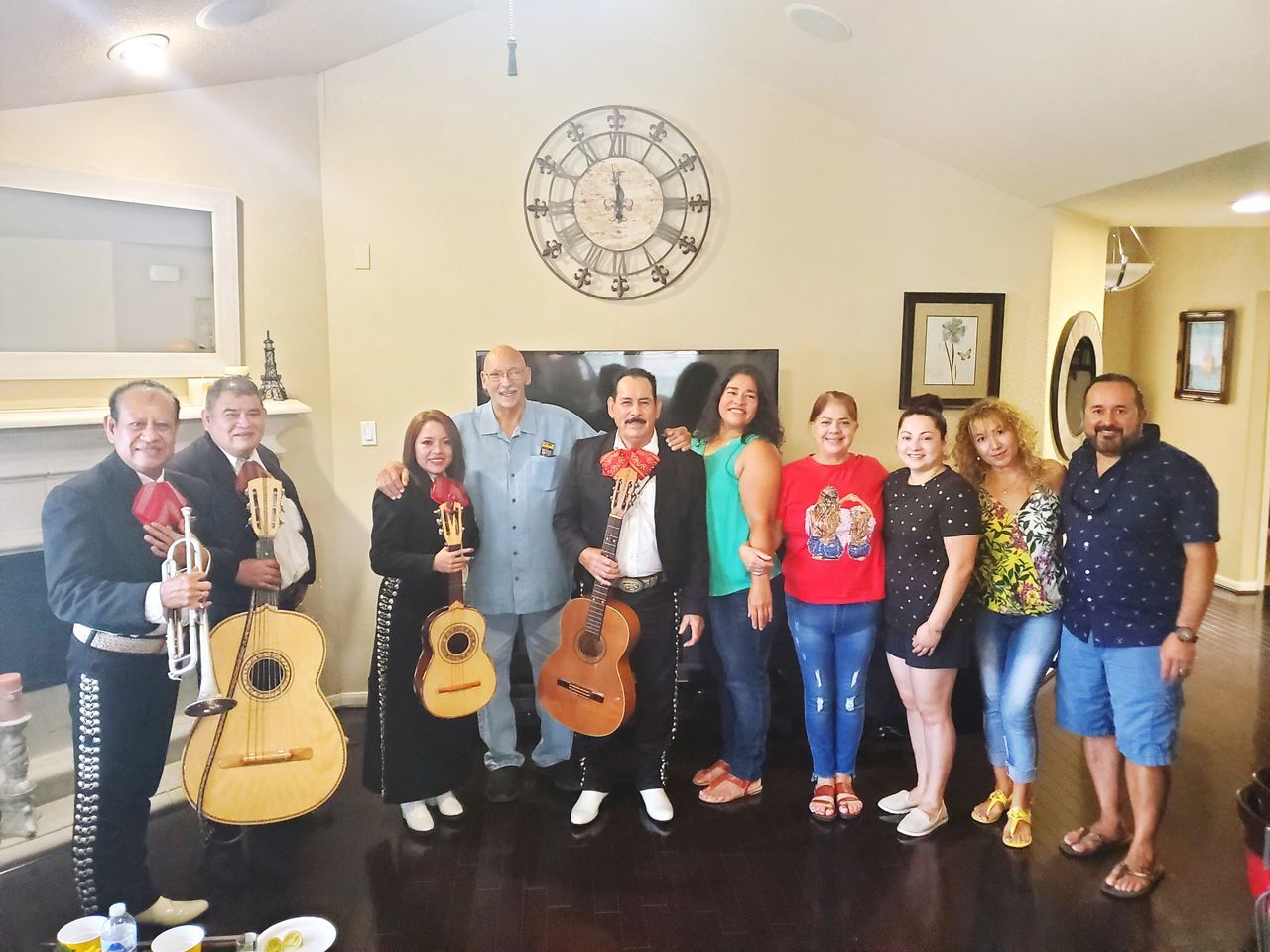 group of people, adult, men, women, smiling, young adult, indoors, full length, standing, togetherness, happiness, female, guitar, string instrument, portrait, cheerful, friendship, mature adult, musical instrument, music, group, looking at camera, arts culture and entertainment, crowd, child, emotion, person, social group, occupation, cooperation, medium group of people, teamwork, enjoyment