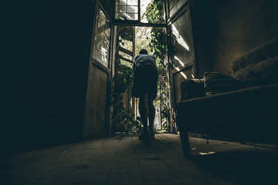 Rear view of man standing in building