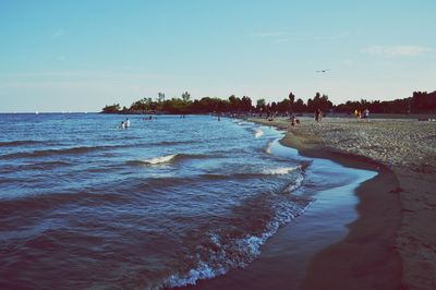 Scenic view of sea against blue sky