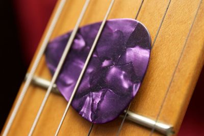 Close-up of guitar with pick