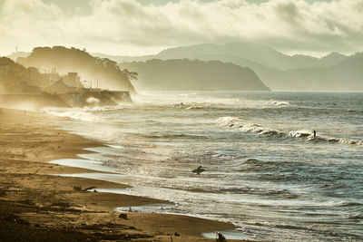 Scenic view of beach against sky