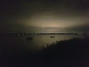 Scenic view of sea against sky at night