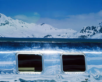 Close-up of snowcapped mountains against sky