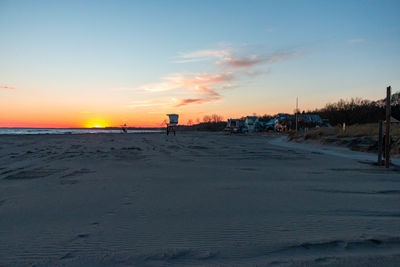 Scenic view of beach against sky during sunset