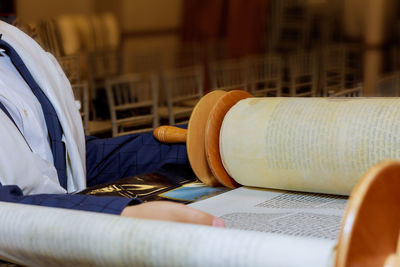 Close-up of old traditional scroll on table