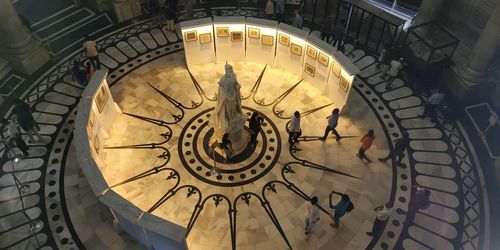 High angle view of people by statue