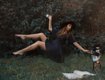 Young woman lying on field