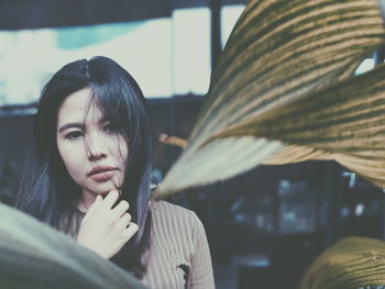 Close-up of young woman sitting outdoors