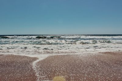 Scenic view of sea against clear sky