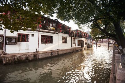 Canal amidst buildings in city