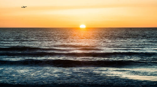 Scenic view of sea at sunset