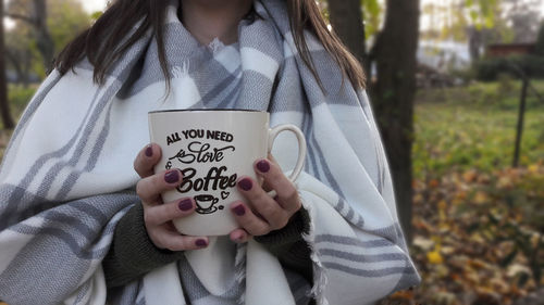 Midsection of child holding hands