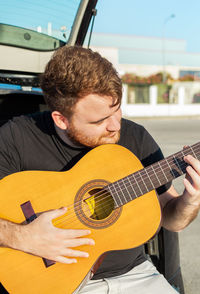 Young man playing guitar
