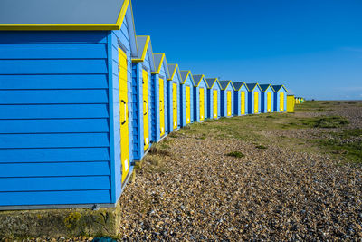 View of beach against clear blue sky