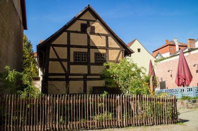 Low angle view of building against clear blue sky