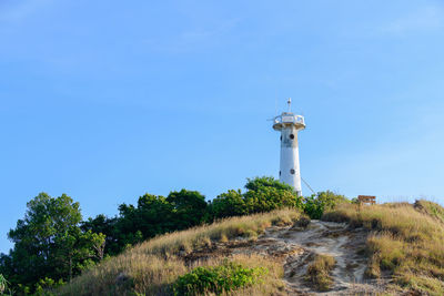 White lighthouse on a cliff at lanta noi island, south of thailand krabi province, 