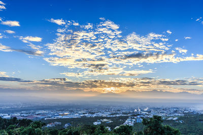 Scenic view of landscape against sky at sunset