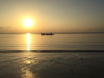 Scenic view of sea against clear sky during sunset