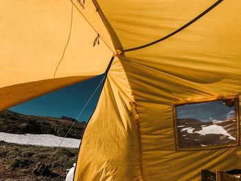 Tilt image of tent on land against sky