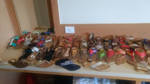 High angle view of shoes arranged on shelf