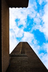 Low angle view of building against cloudy sky