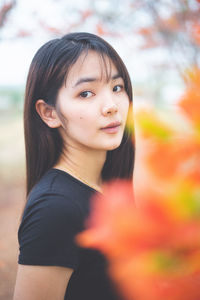 Portrait of smiling woman standing outdoors