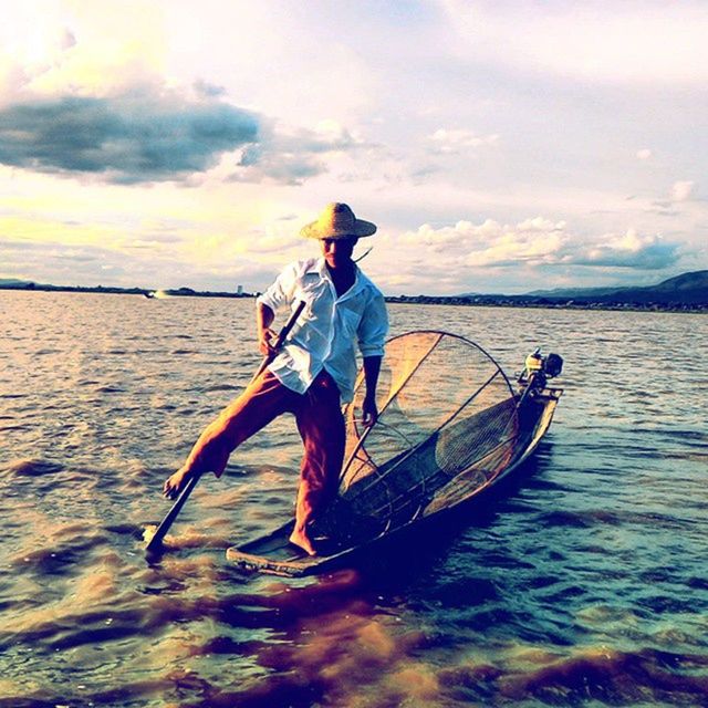 water, sky, full length, lifestyles, leisure activity, sea, transportation, men, mode of transport, cloud - sky, nautical vessel, scenics, rear view, tranquil scene, waterfront, travel, vacations, beauty in nature