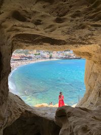 Woman on rock at beach