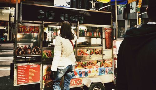 People at market stall