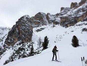 Tourists on snowcapped mountain