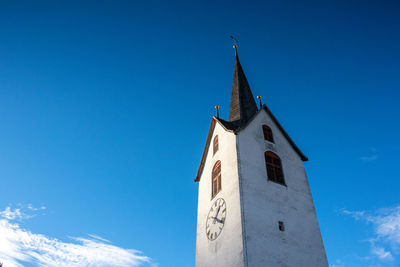 Low angle view of church against blue sky