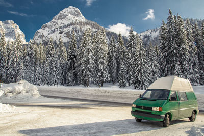 View of cars on snow covered land