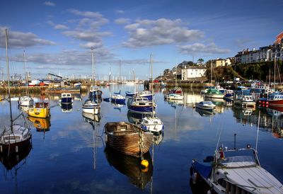 Boats moored at harbor