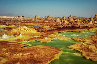 Scenic view of rock formations in water