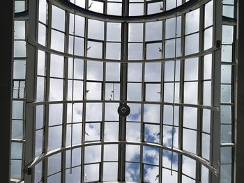 Low angle view of glass window in building