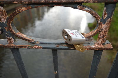 Close-up of padlock on railing