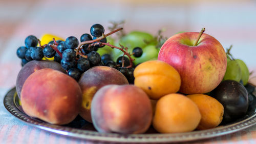 Close-up of apples in container on table